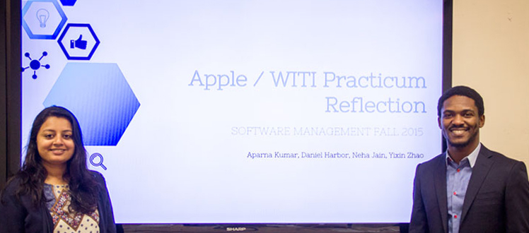 students giving a presentation to apple