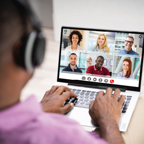 looking over the shoulder of a person on zoom on their laptop