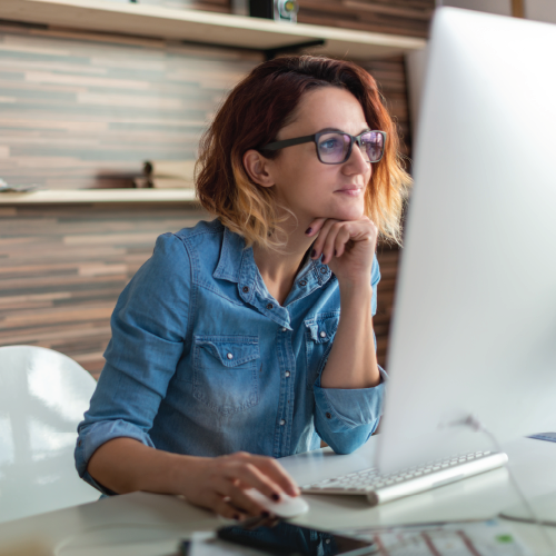 girl sitting at desk on computer