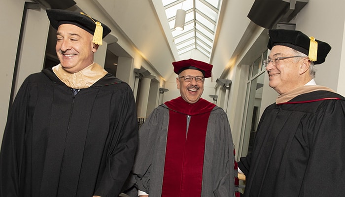 A photo of Farnam with Keith Block and Jim Rohr proceeding into investiture