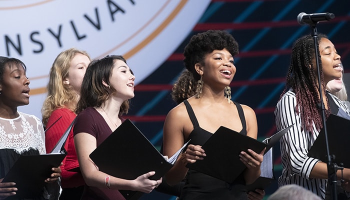 A photo of students singing at the investiture