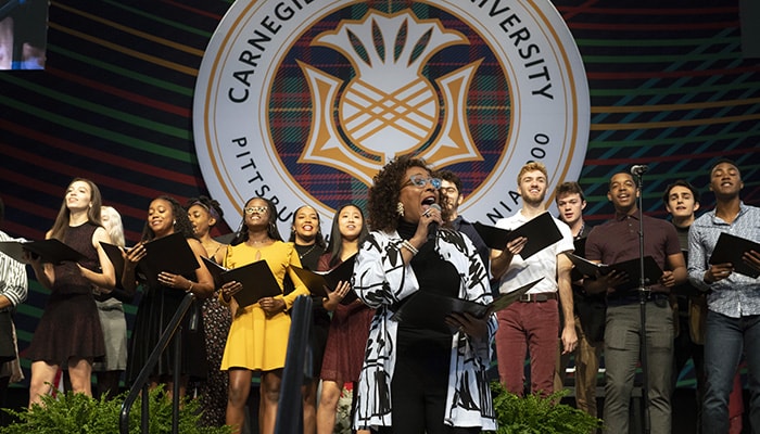 A photo of Tamara Tunie singing 