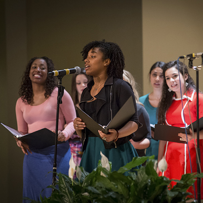 Female students performing at a talent show