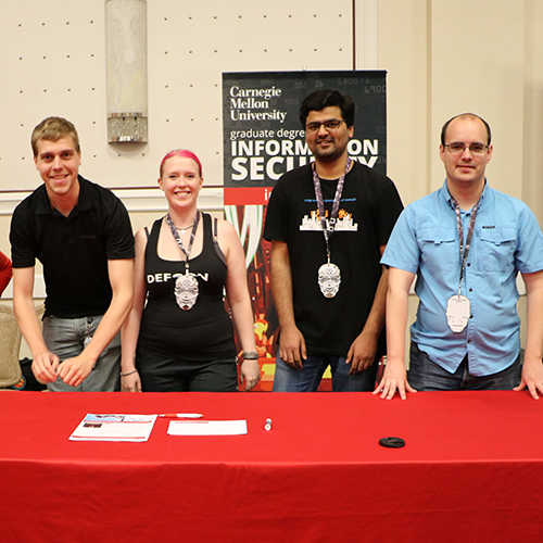 Students at DefCon conference booth
