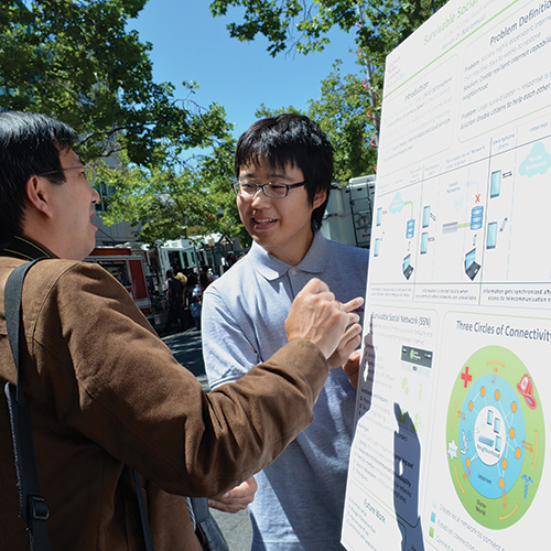 Student speaking with a professor.