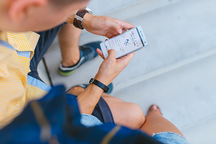 Individual holding an Android phone.