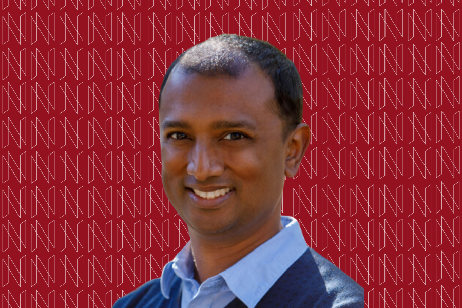 Decorative graphic featuring Professor David Varodayan on a red background with "N" designs