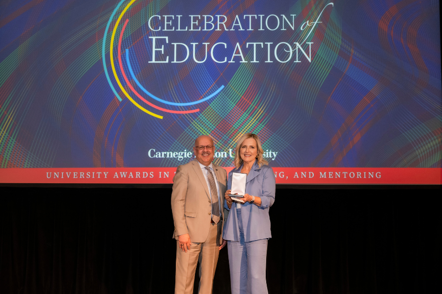 Dena with President Jahanian on stage