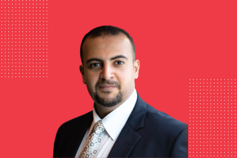 Mohamed Farag posed on a red background