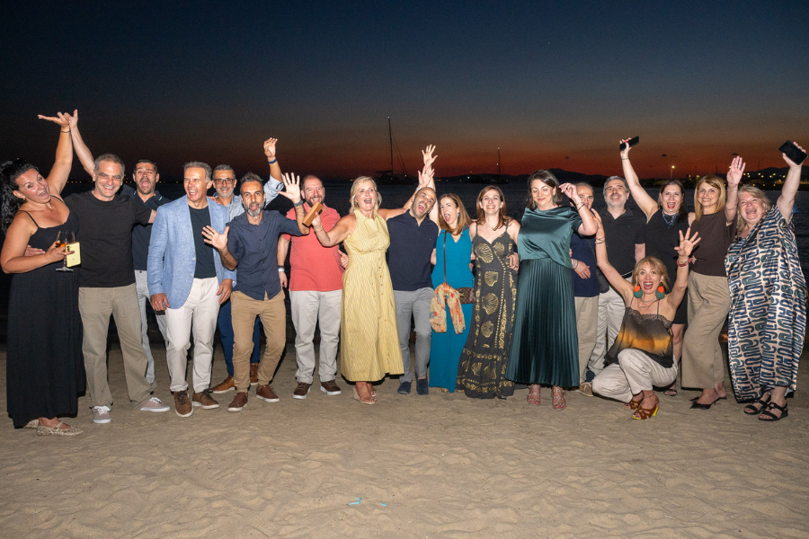 INI Director Dena Haritos Tsamitis on the beach with Athens alumni