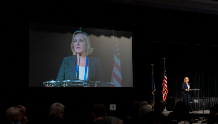 Dena Haritos Tsamitis speaking at the CAE Symposium