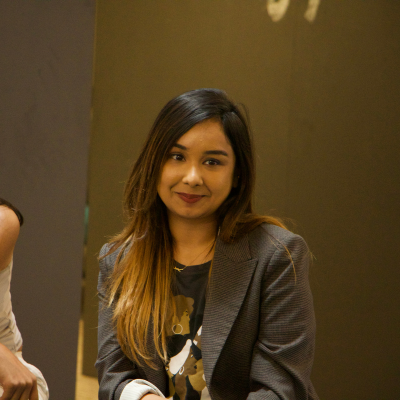 Neha Gautam speaking to students at the INI