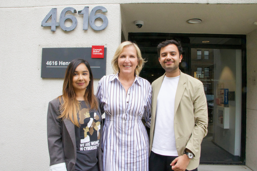 Neha Gautam, Dr. Dena Haritos Tsamitis and Prerit Pathak outside of the INI