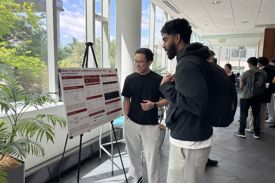 Students presenting posters at a poster session