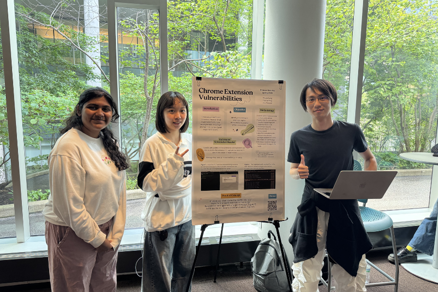 Students presenting posters at a poster session.
