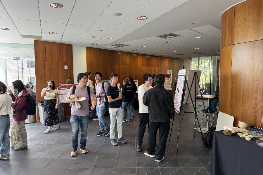 Students presenting posters at a poster session.