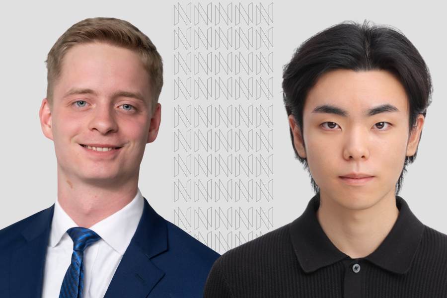 Two students posed on a grey background
