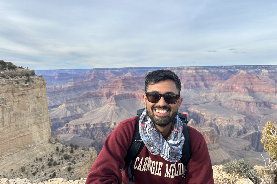 Vikramraj Sitpal posing for a picture in a national park
