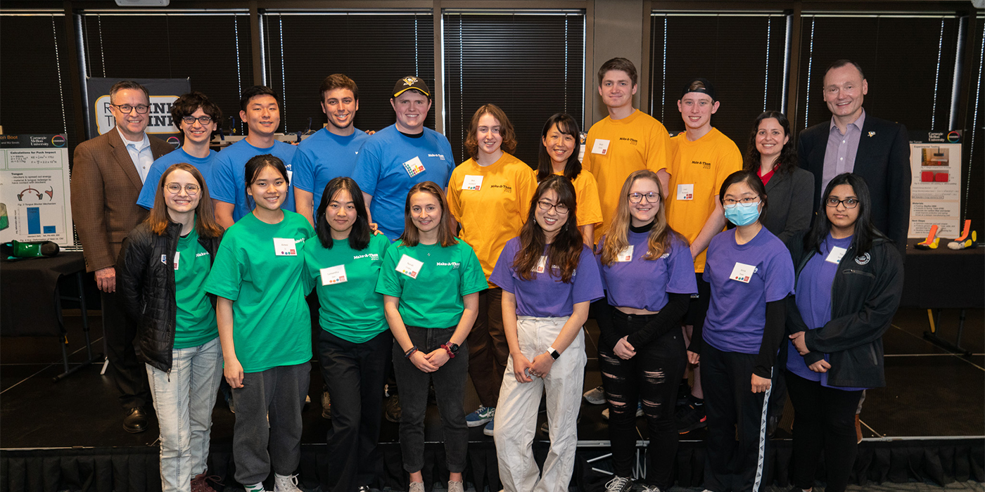 student participants in Rethink the Rink pose with members of Covestro and Pittsburgh Penguins teams