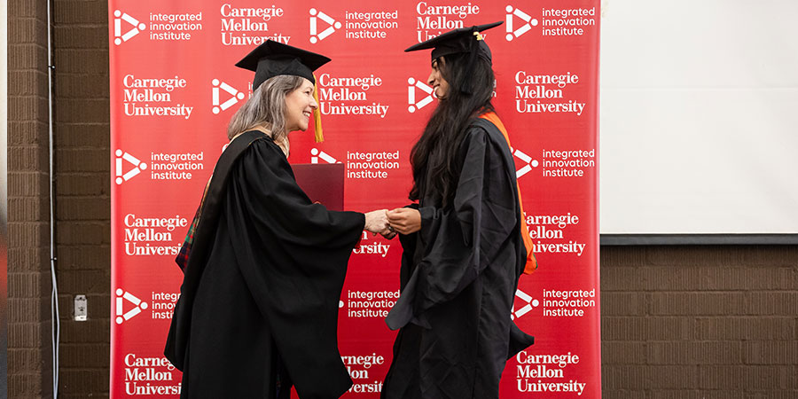 female graduate at graduation ceremony