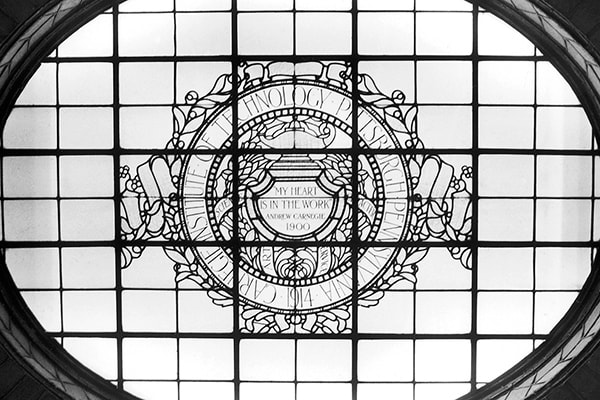 A photo of an ornate window in Baker hall.