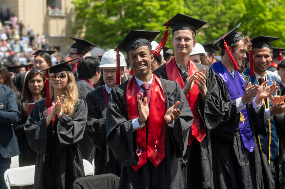 Students clapping and cheering during Commencement 2022 