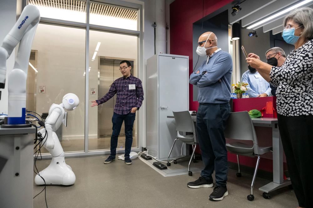 student demoing a robot at the JPMorgan AI Maker Space