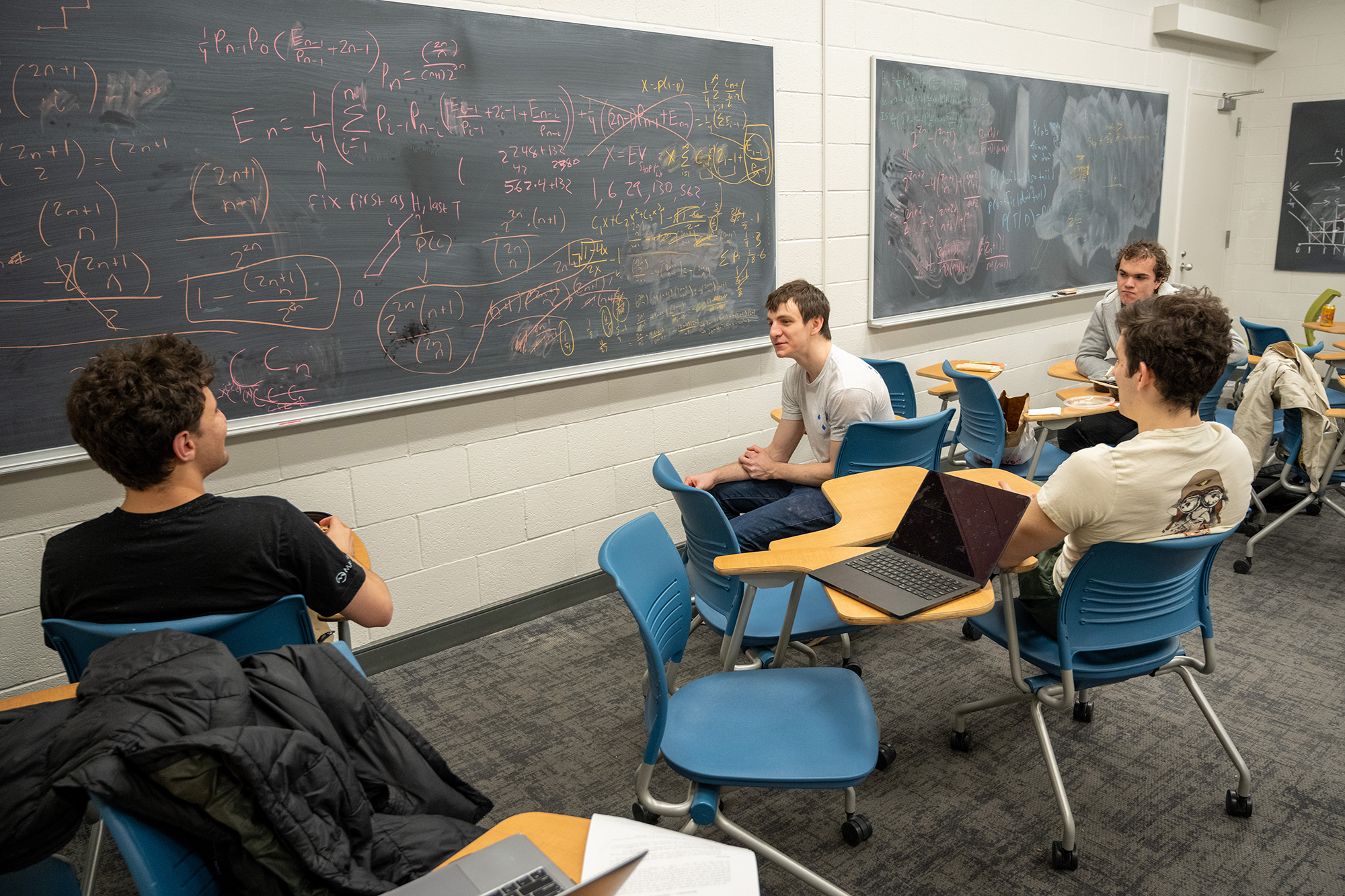 Harrison Wiseblatt, Mario Tutuncu-Macias, Gil Shteyman and Max Grebinskiy sit and discuss the problem