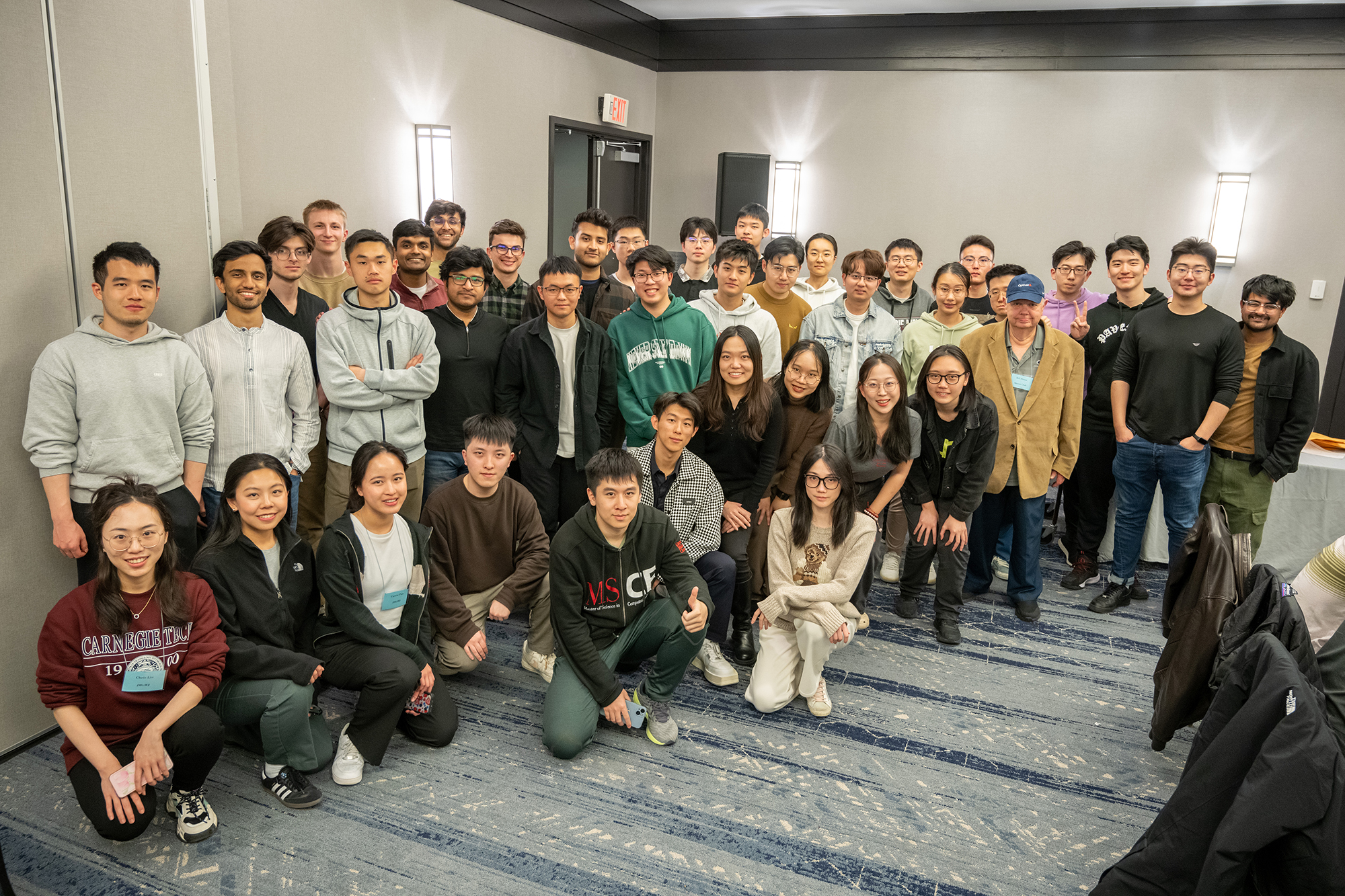 a large group of students pose for a photo