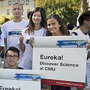 photo of students holding Eureka! signs