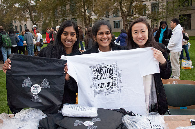 Students showing off MCS backpacks and t-shirts at MCS Pride Day