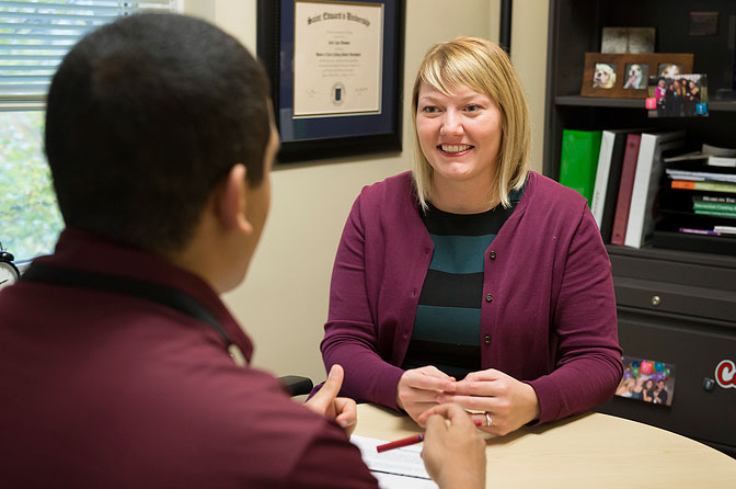 Katie Thompson talking to student