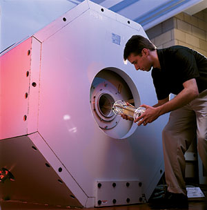 Kevin Hitchens loading sample into NMR