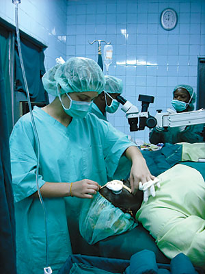 Kilp in scrubs assisting in cataract surgery