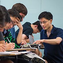 photo of Po-Shen Loh and classroom of students