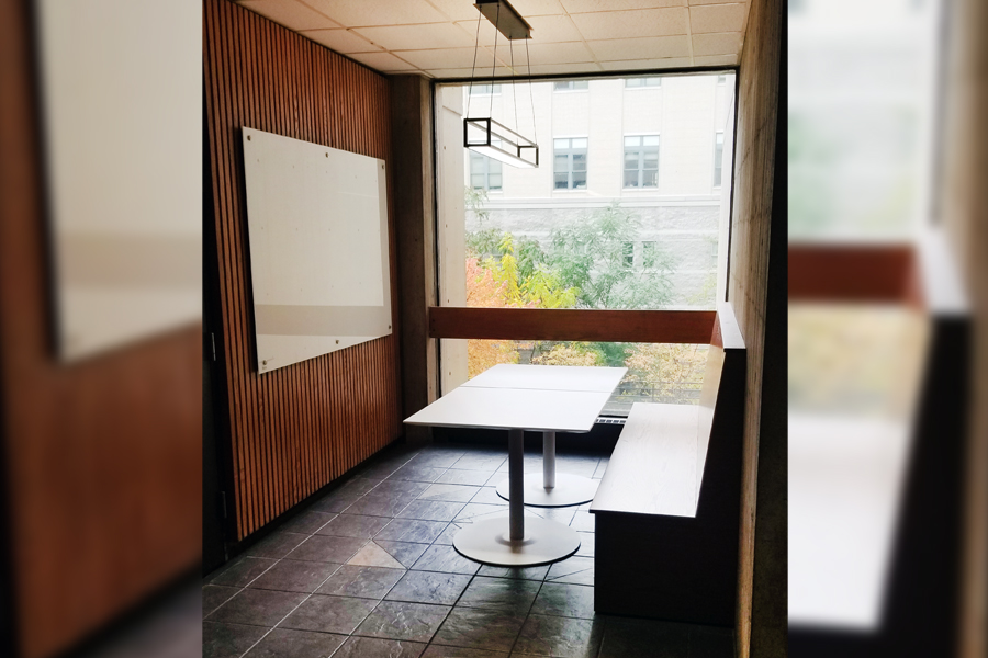 An updated study Nook with wooden booth and white table in Wean Hall 2b