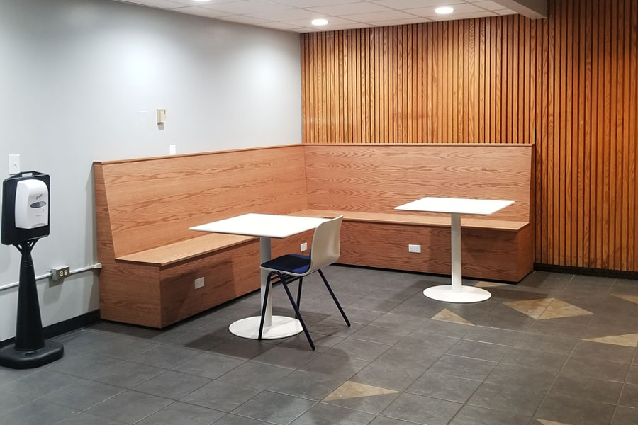 An updated Nook with wooden booth and white tables in Wean Hall 2a