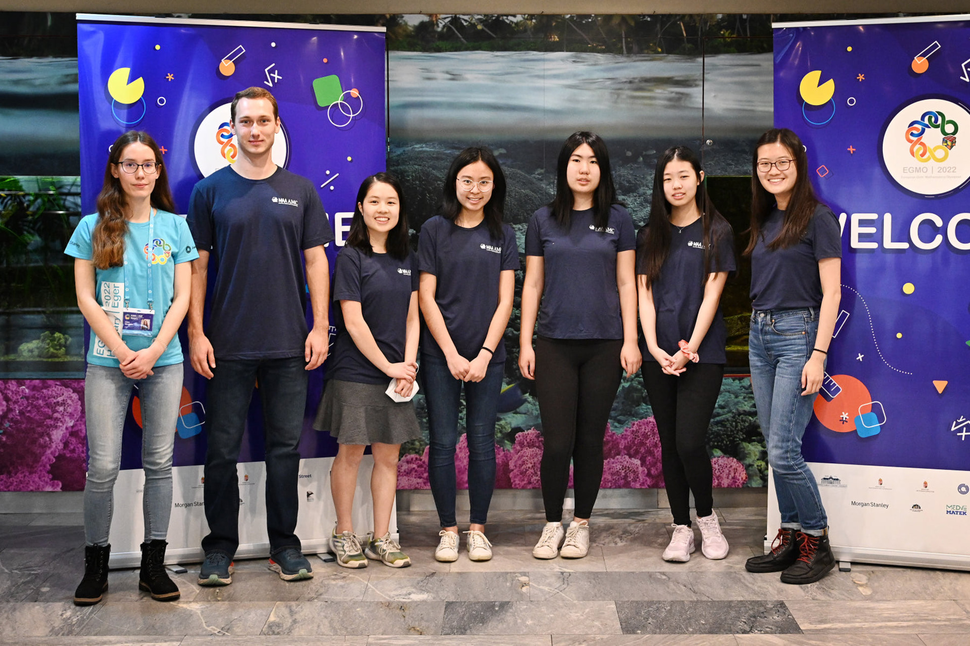 Photo of Alex Rudenko and the U.S. Girls Mathematical Olympiad Team