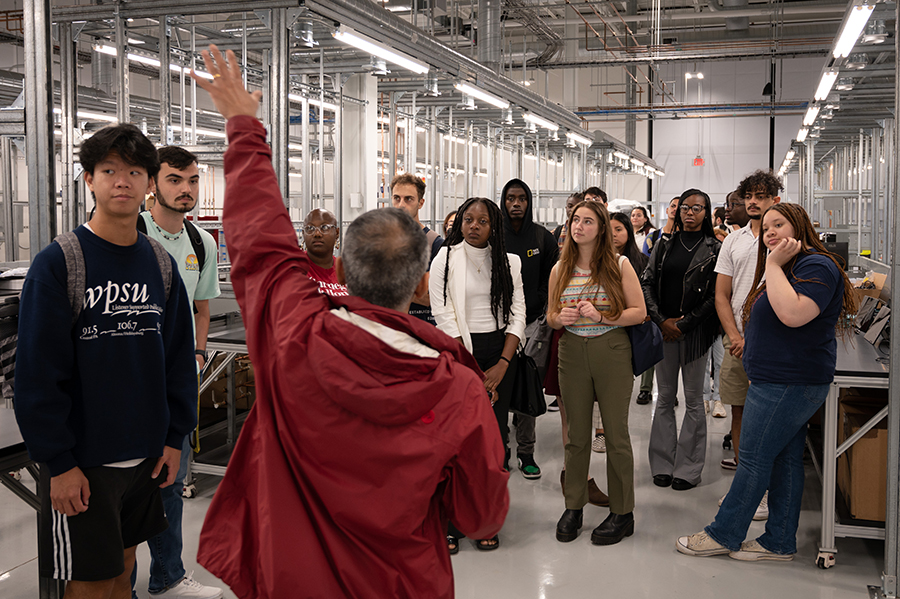 Subha Das leads a tour of the Carnegie Mellon University Cloud Lab