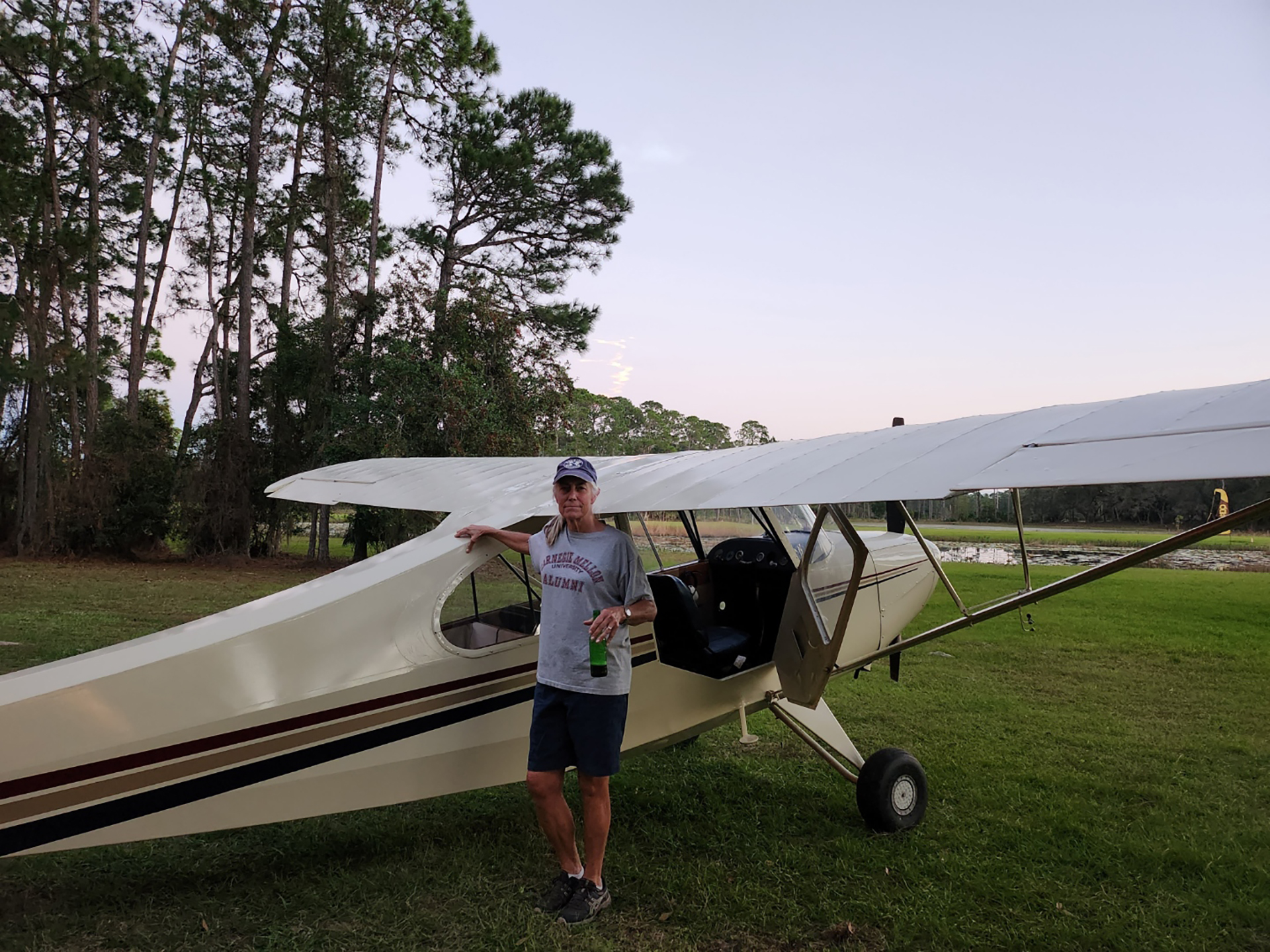 Image of woman next to a plane