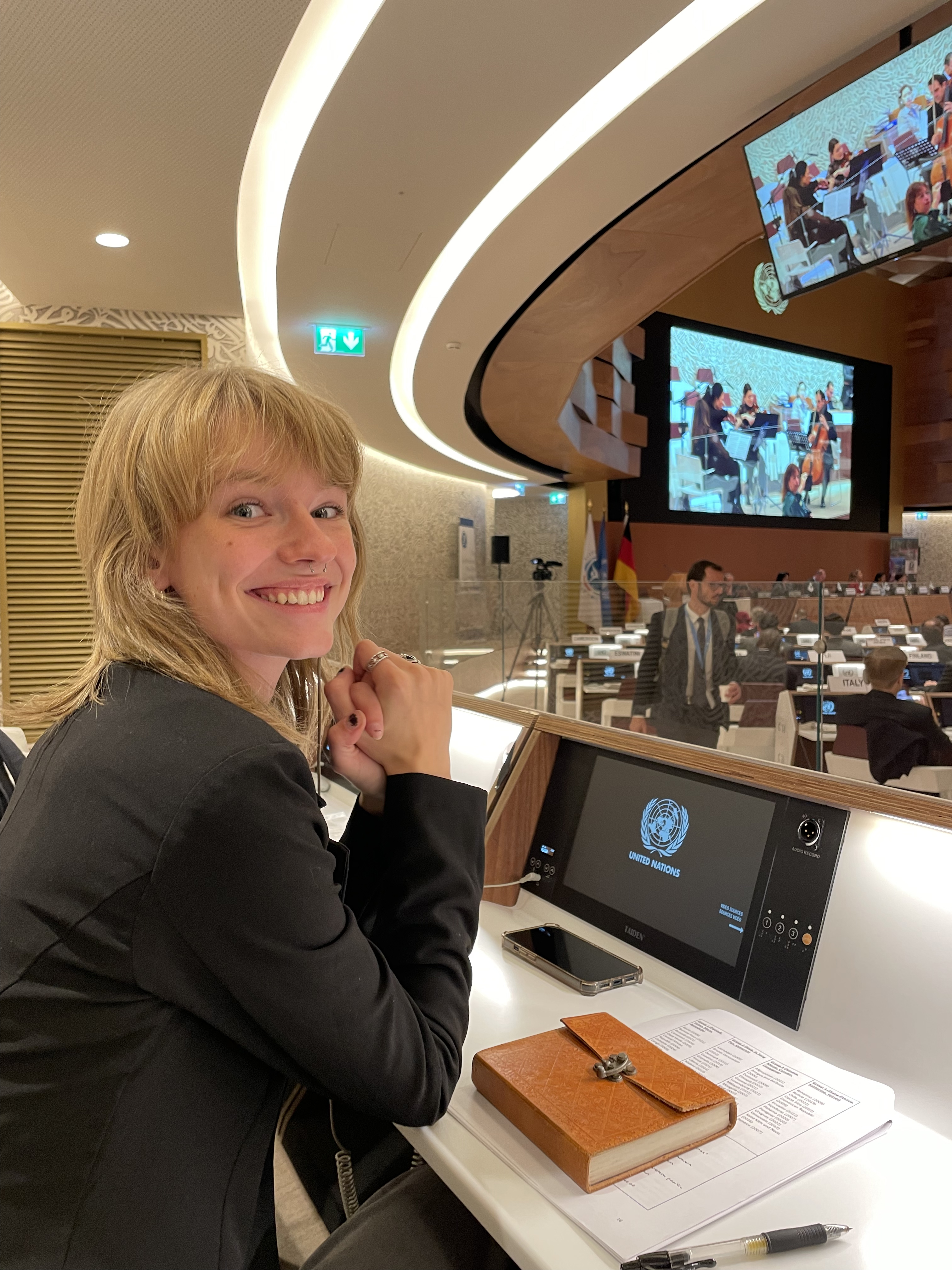 Tatum Rasmussen sits in the UN meeting