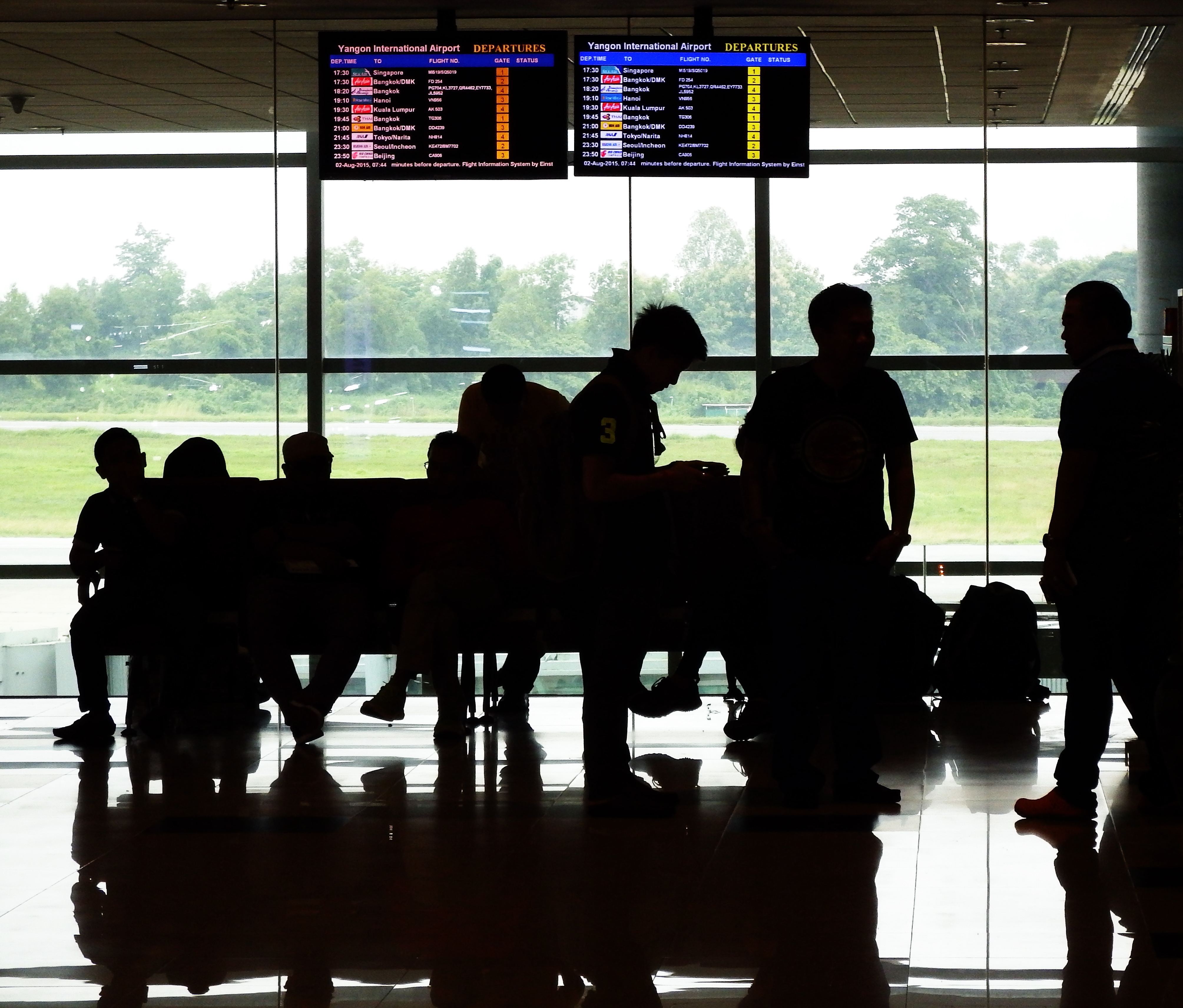 Silhouettes at Airport while waiting