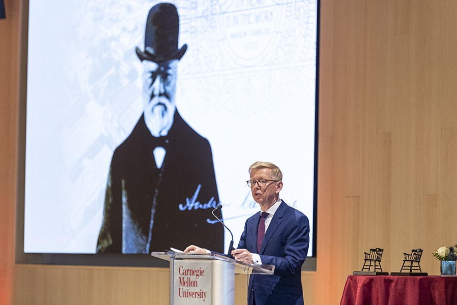 Webster speaks at a podium