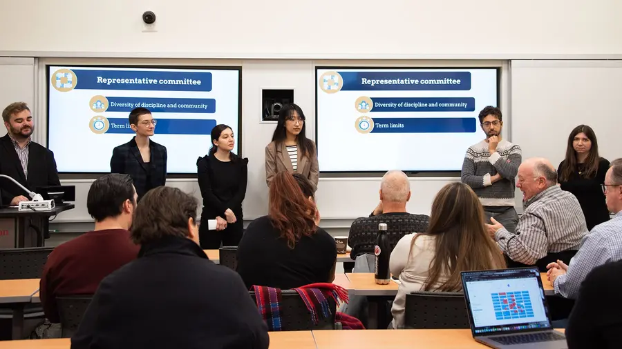 Students presenting at front of classroom