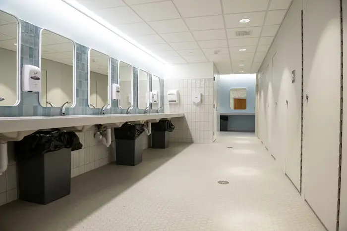 Inside restroom looking at line of sinks
