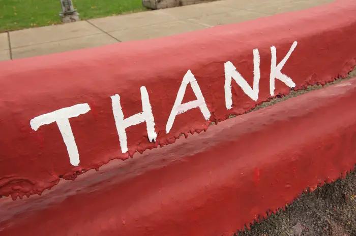 Thank written on the Fence