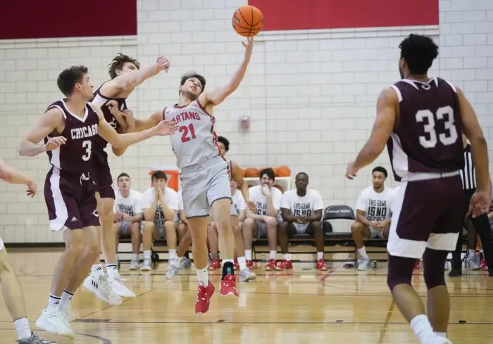 Jack Stone fights for possession during their game against the University of Chicago.