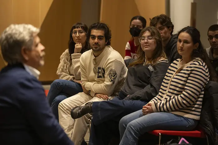 John Wells speaks with CMU students.
