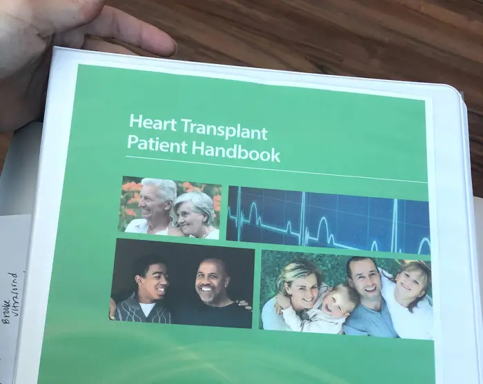 Jordan Mace reviews the binder to list Tristan for a Heart Transplant. Photo courtesy of Jordan Mace.