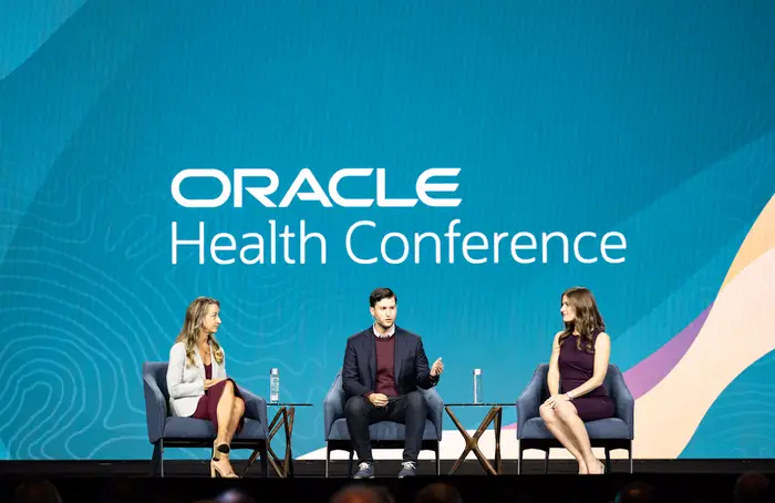 Tristan and Jordan Mace onstage at the Oracle Health Conference in 2023.